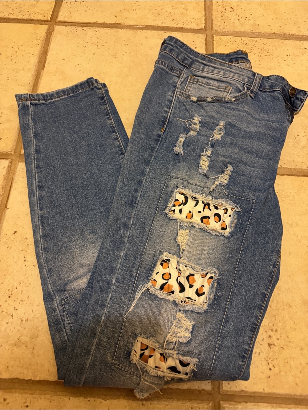 Women’s Blue Distressed Jeans with Leopard Patch Detail